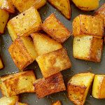 close up view of cooked potatoes in skillet