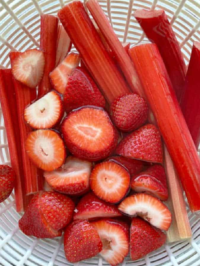 a bowl full of fresh strawberries and rhubarb