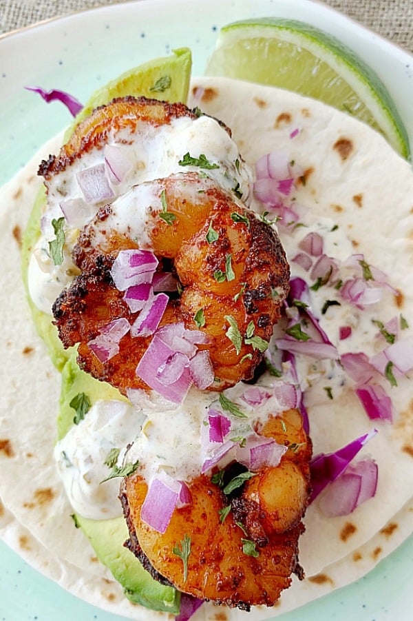 assembled shrimp taco on a plate