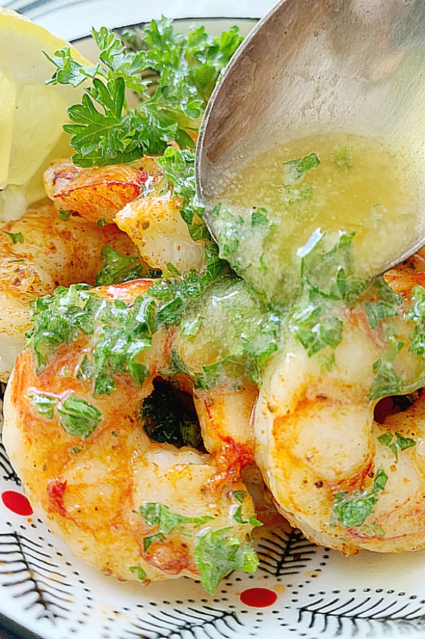 pouring butter over shrimp