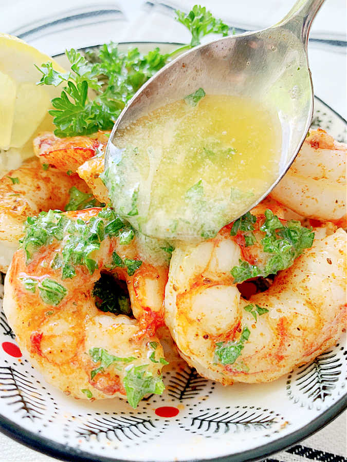 air fried shrimp being bathed in a lemony butter sauce