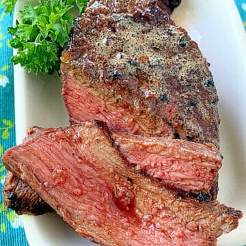 sliced and plated, grilled and marinated steak