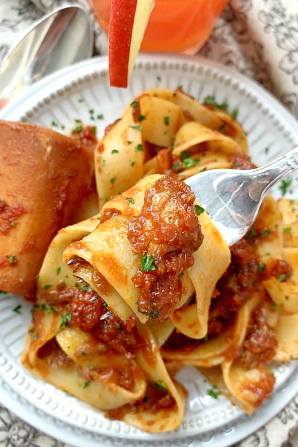 forkful or osso buco ragu with pasta