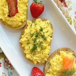 overhead view of creamy scrambled egg toasts