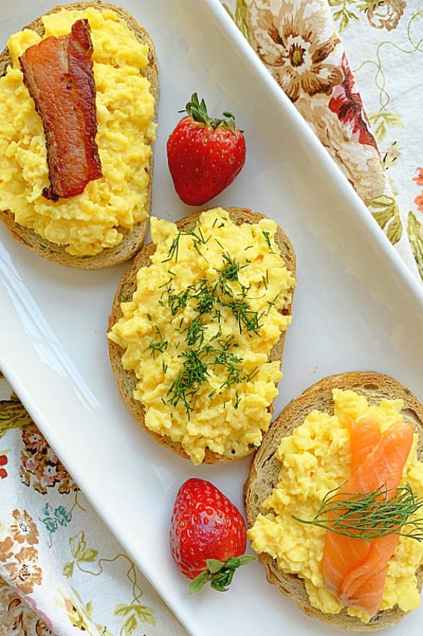 overhead view of creamy scrambled egg toasts