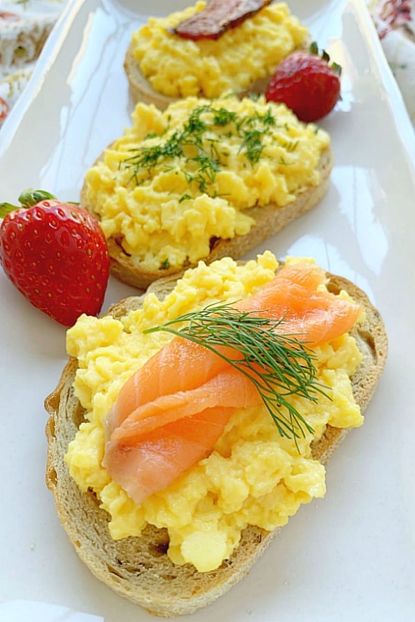 creamy scrambled egg toasts on a platter