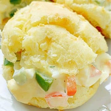 a cheese puff filled with homemade deviled egg salad