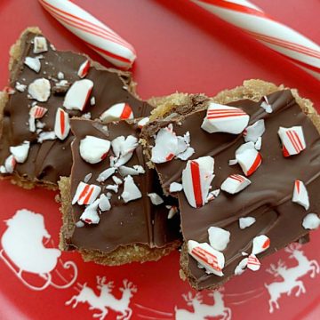 chocolate chip cookie candy crackle on a plate with candy cane