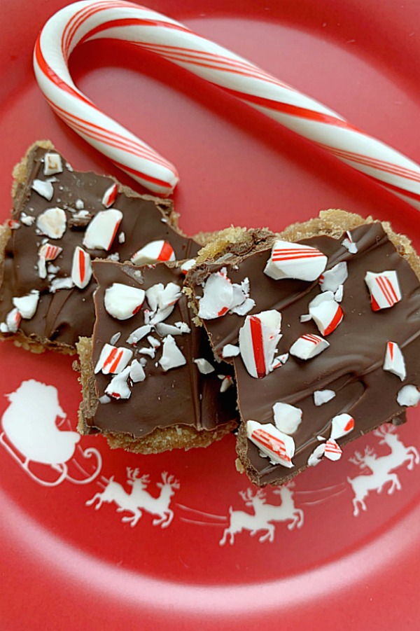 chocolate chip cookie candy crackle on a plate with candy cane