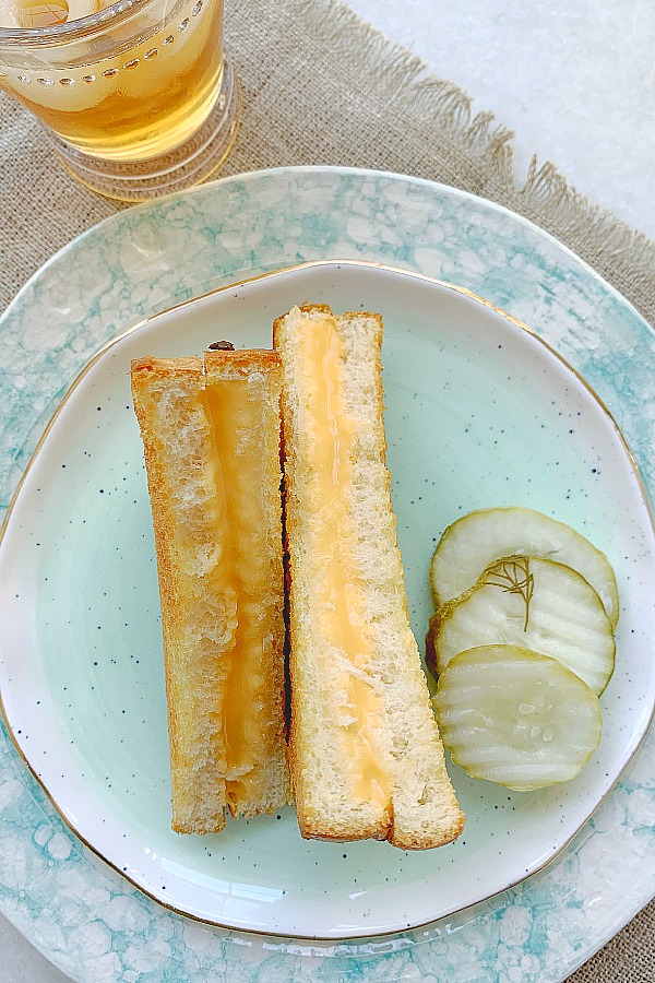 air fryer grilled cheese on plate with pickles