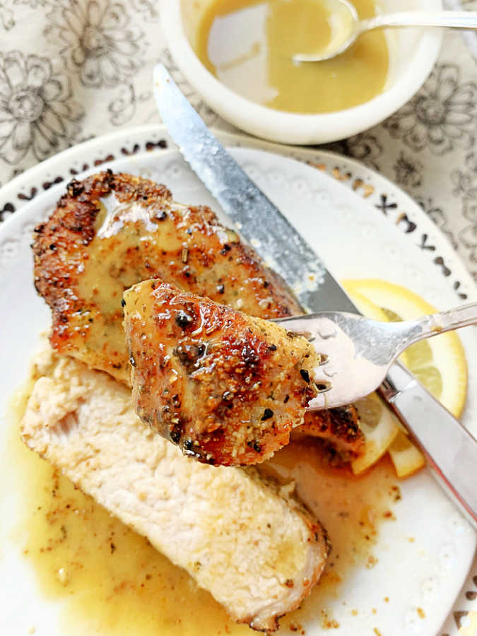 taking a bite of an air fryer pork chop