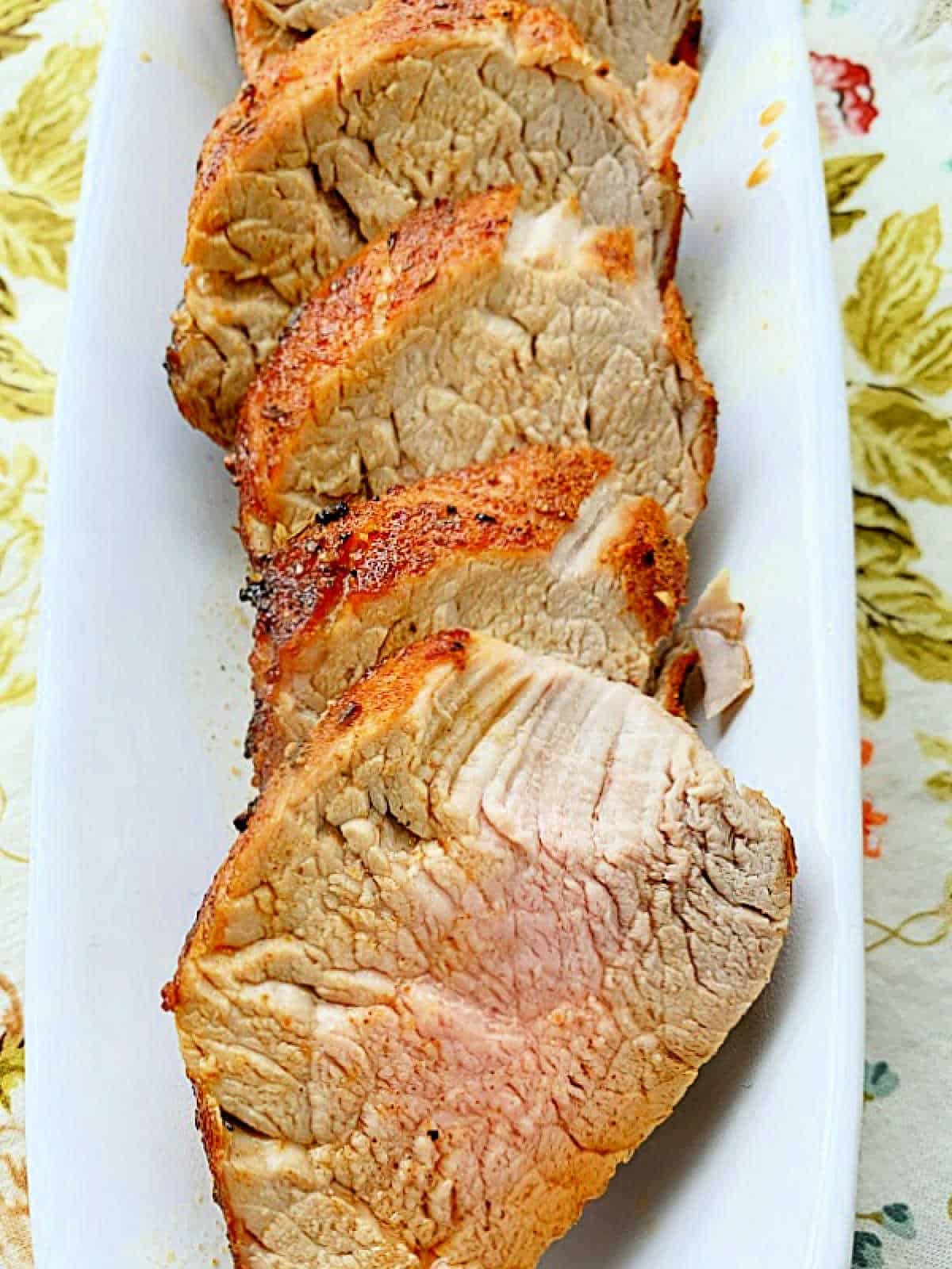 slices of pork tenderloin on a platter ready to serve