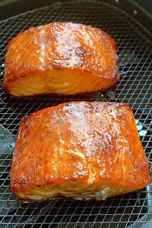 cooked salmon filets in the air fryer basket