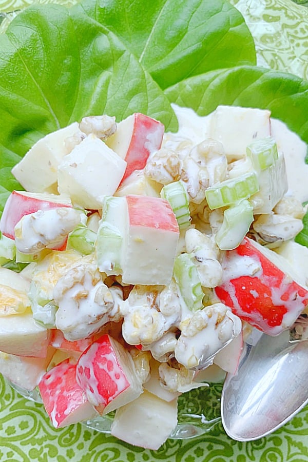 apple salad on a plate with spoon