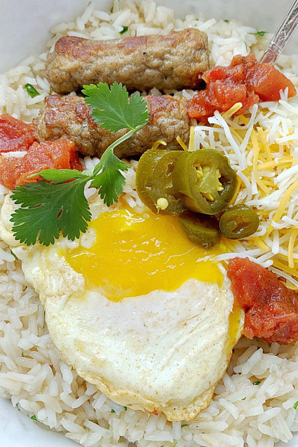 close up view of fried egg in breakfast rice bowl