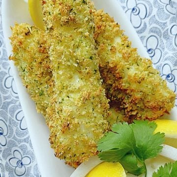 showing finished air fryer fish sticks on a plate