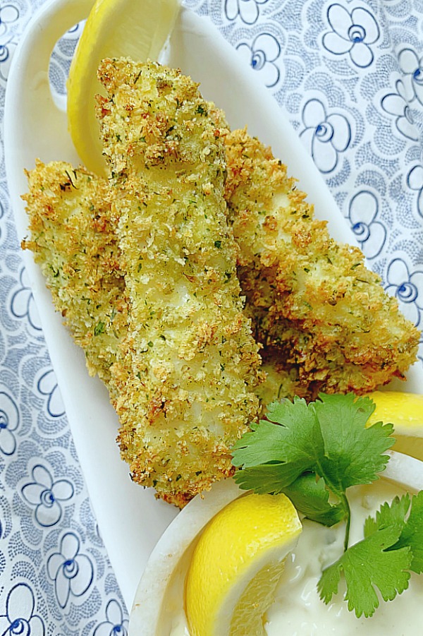 showing finished air fryer fish sticks on a plate