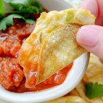 dipping mini tacos in salsa