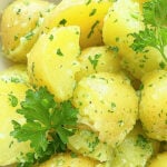 a close-up photo of deliciously yellow parsley potatoes