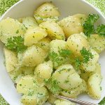 overhead view of parsley potatoes in a bowl