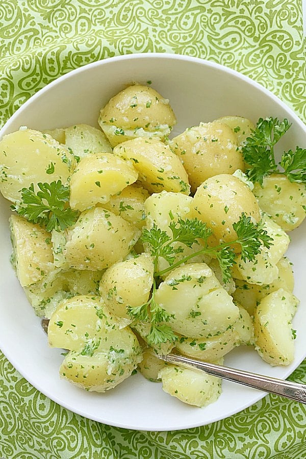 overhead view of parsley potatoes in a bowl