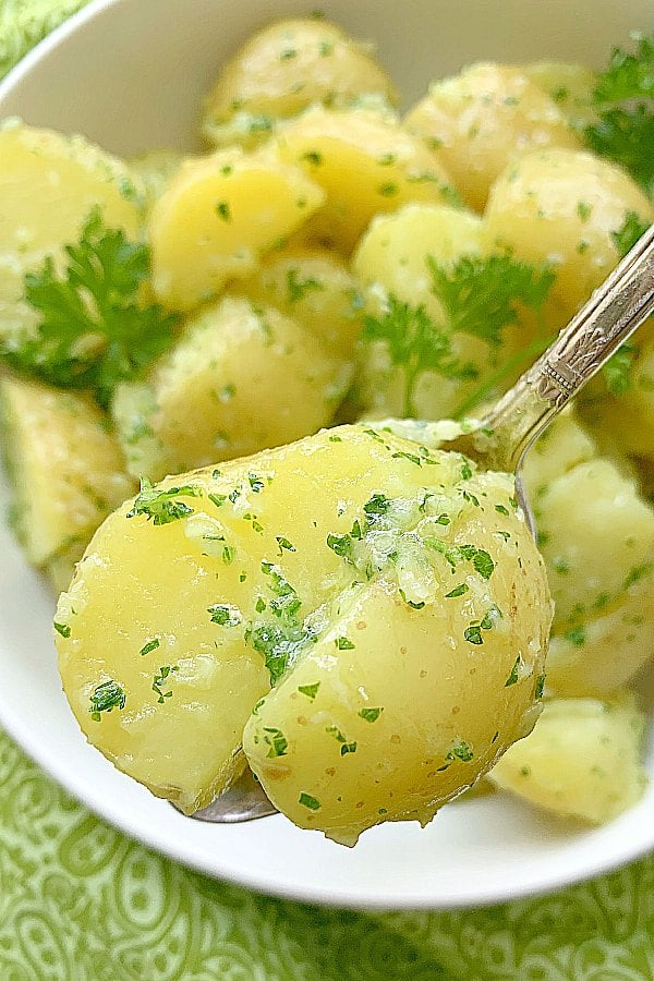 close up of parsley potato in a spoon