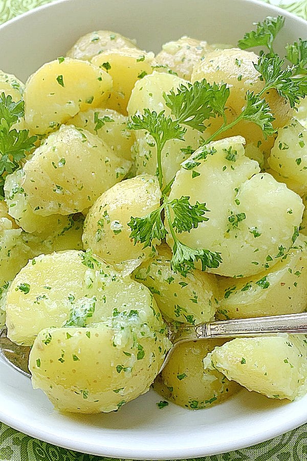 showing parsley potatoes in a bowl