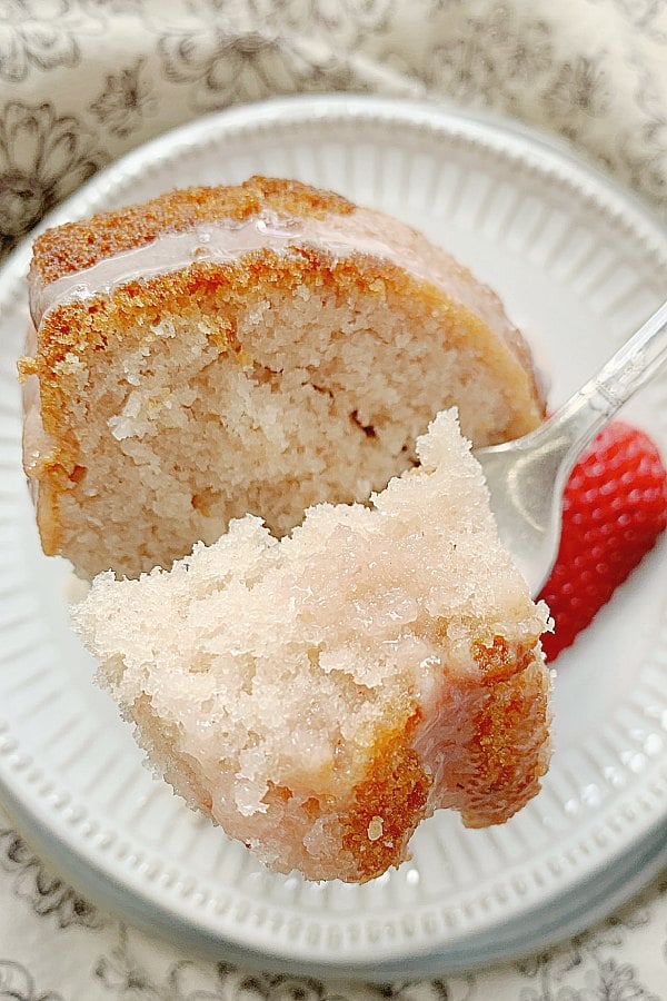 taking a bite of strawberry bundt cake