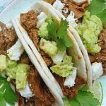 three steak tacos on a plate