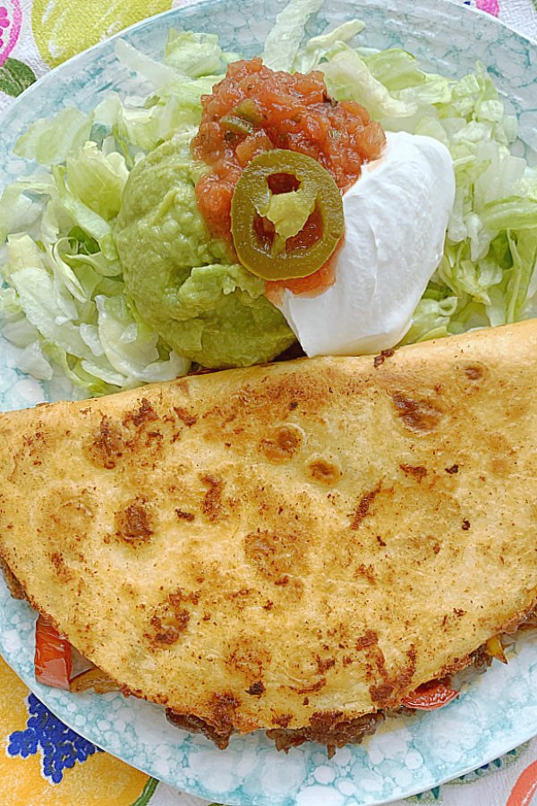 whole steak fajita quesadilla on a plate