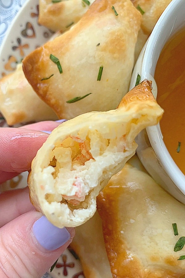 air fryer Crab Rangoon with a bite taken out of it