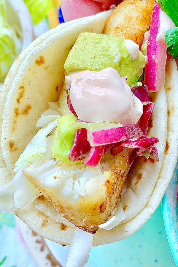 close up view of folded baja fish taco