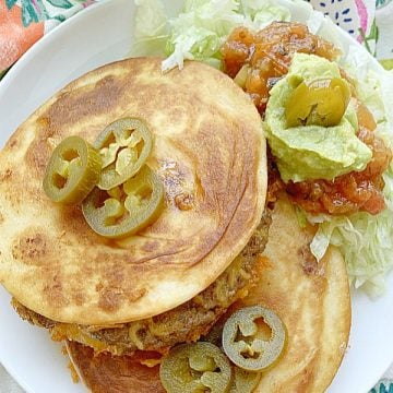 two quesadilla burgers on a plate