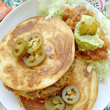 two quesadilla burgers on a plate