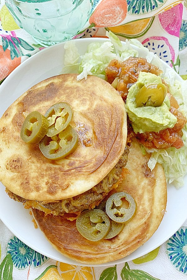 two quesadilla burgers on a plate