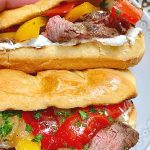 grilled steak sandwiches on a plate