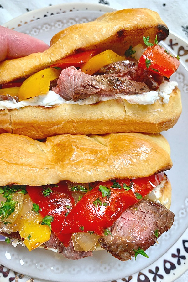 grilled steak sandwiches on a plate