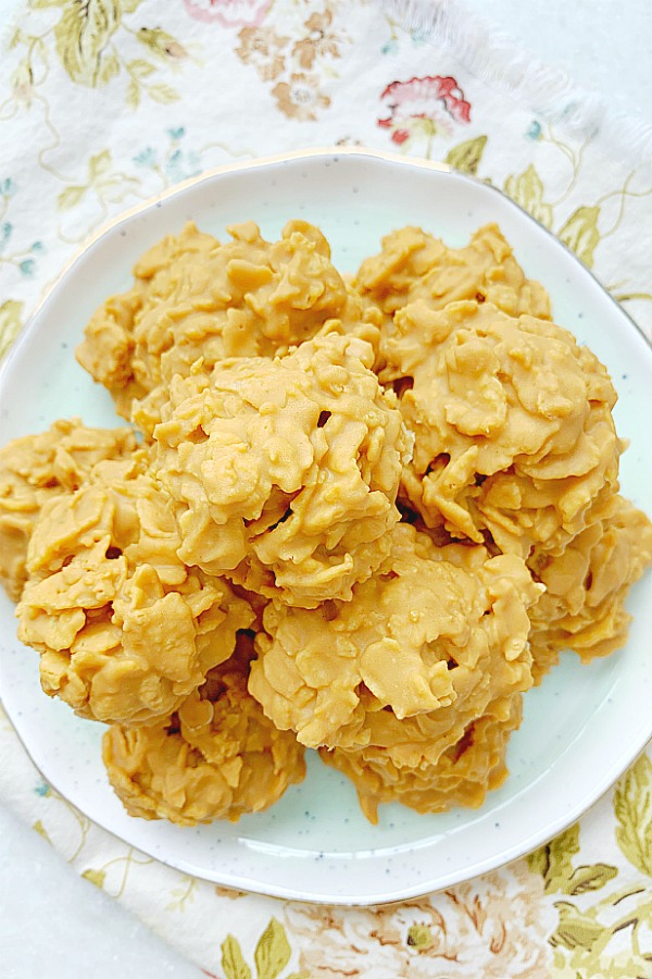 peanut butter cornflake cookies piled on a plate
