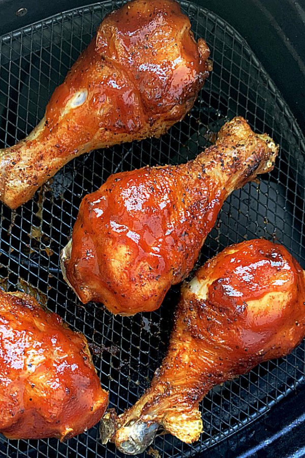 bbq air fryer chicken legs in the air fryer basket