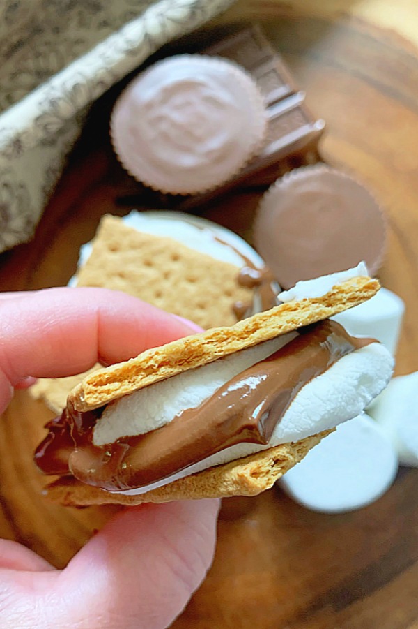 holding an air fryer s'more, ready to take a bite