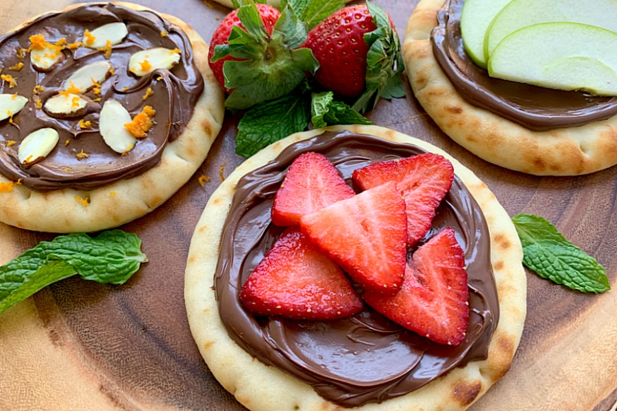 horizontal crop of strawberry nutella pizza on a platter