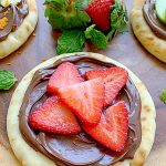 nutella pizza topped with strawberries