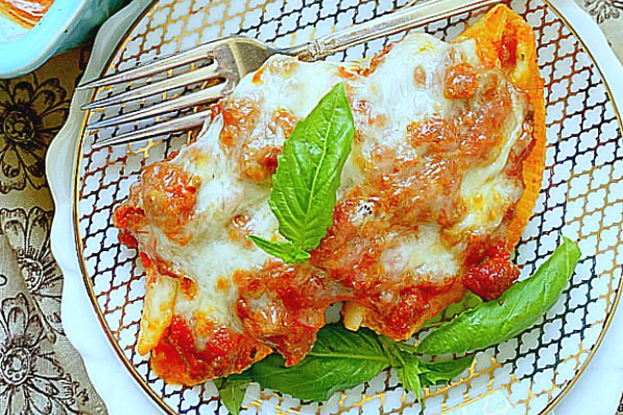 two stuffed shells on a plate 