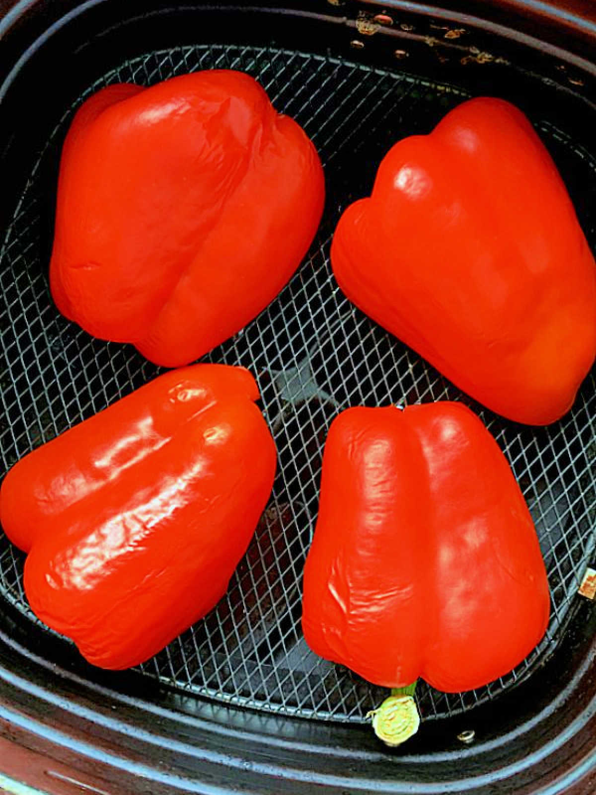 red peppers being fried in the air fryer
