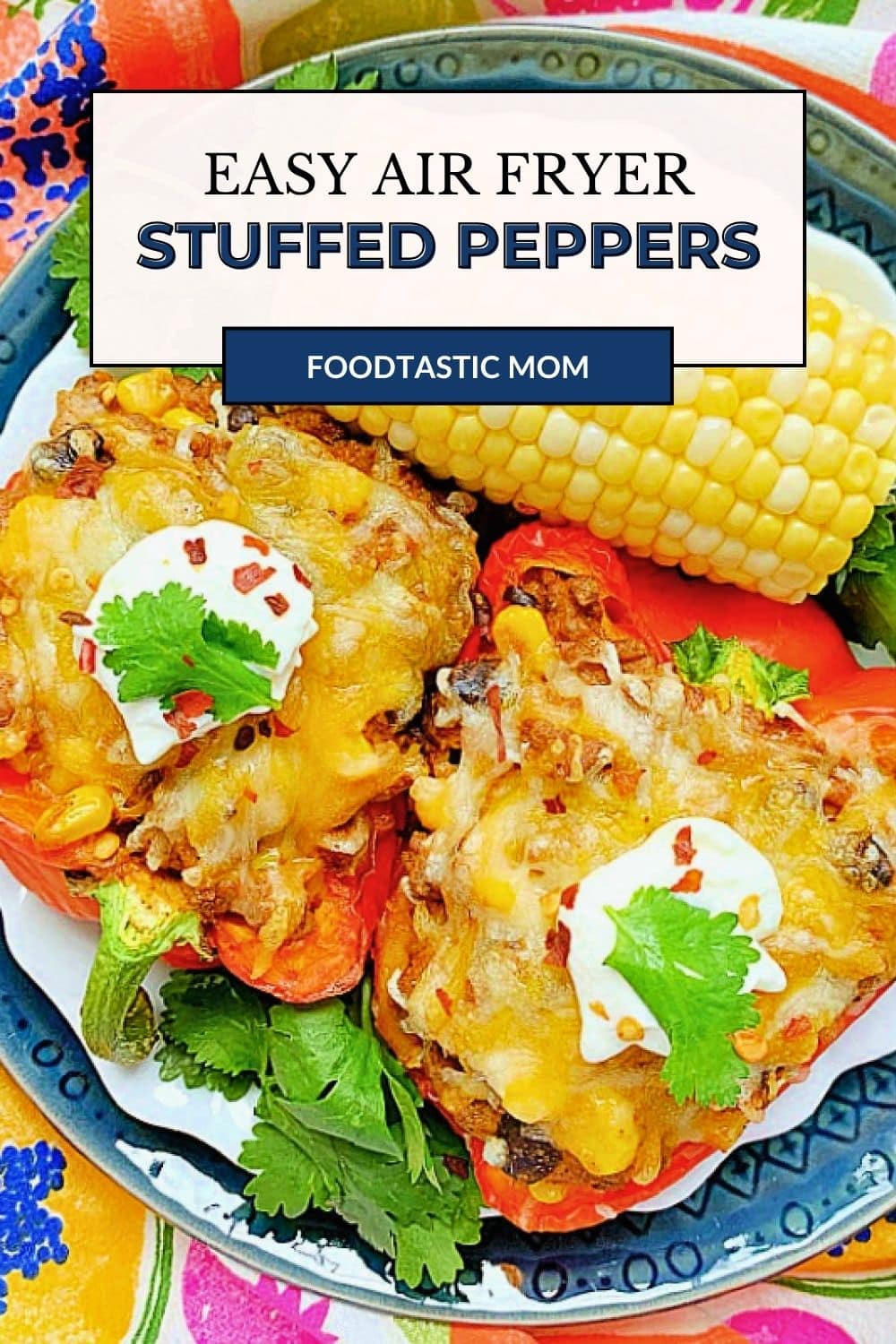 Air Fryer Stuffed Peppers are a wholesome meal for a busy weeknight. Red bell peppers stuffed with taco-seasoned ground beef. via @foodtasticmom
