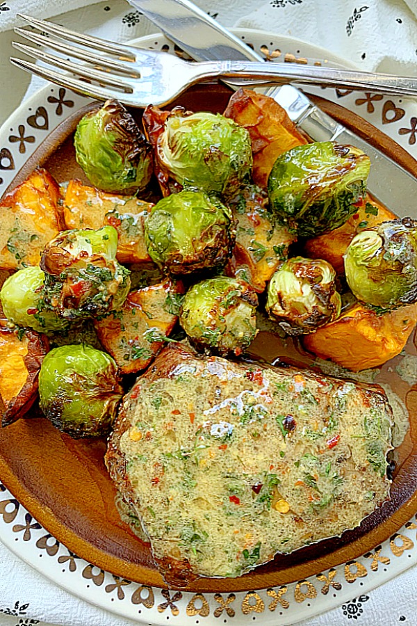 air fryer filet mignon topped with butter sauce