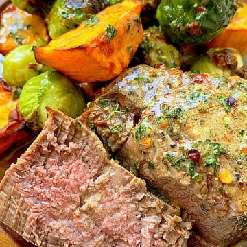 air fryer filet mignon cut in half to show the cook