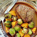 filet mignon on plate with air fried Brussels sprouts and sweet potatoes