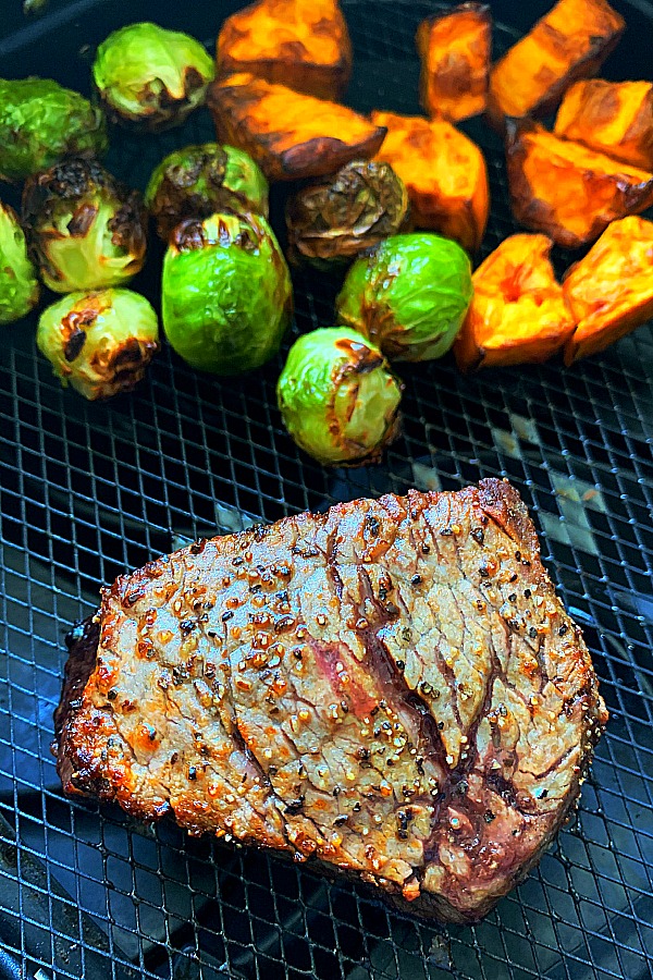 filet mignon, Brussels sprouts and sweet potatoes in the air fryer basket