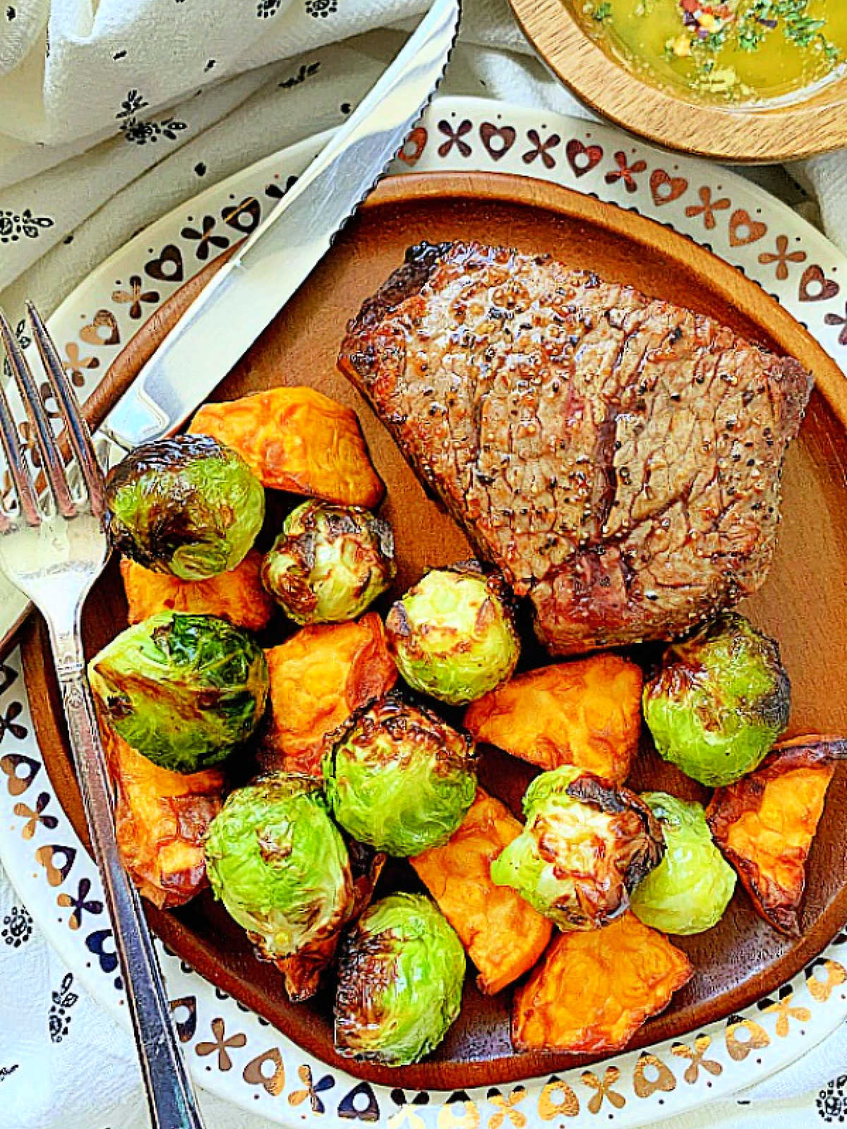 plated air fryer filet mignon with roasted veggies